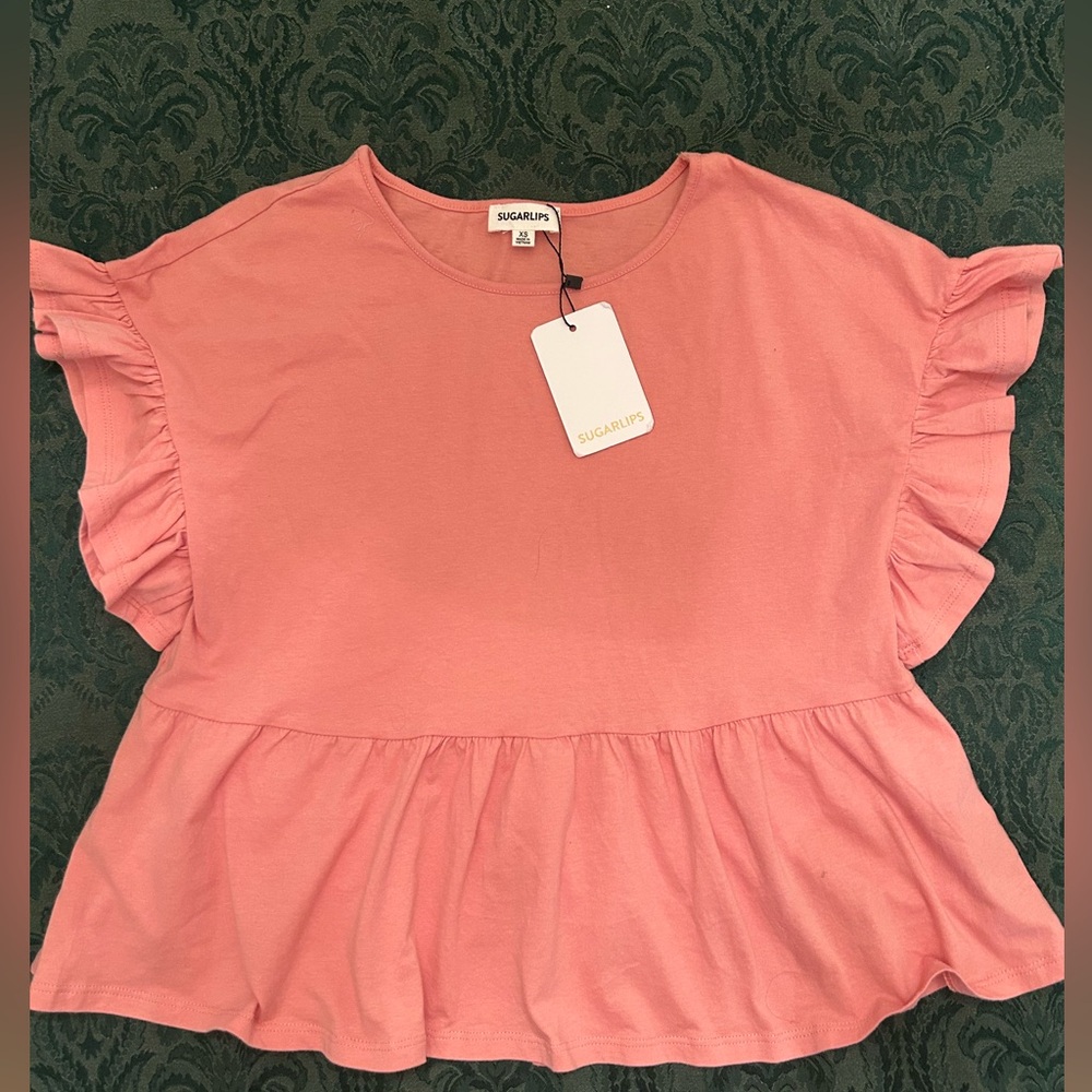 Woman’s ruffled sleeve top size XS. Brand new with tags by Sugarlips.